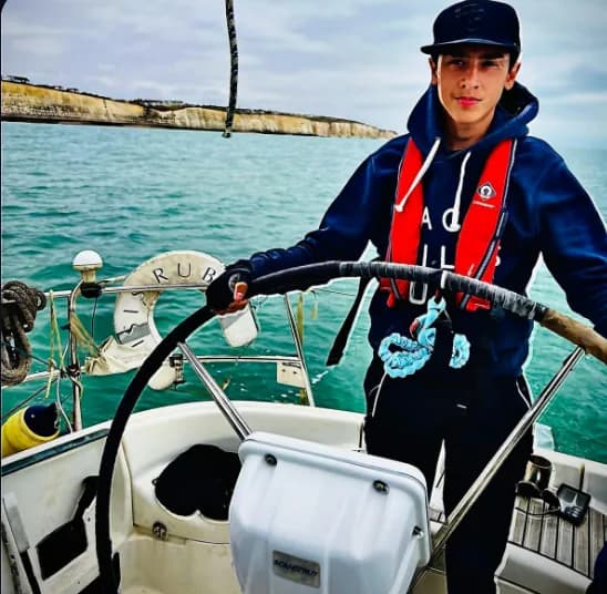 Oliver Rorzkowski at the helm of a sailing boat