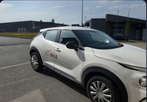 The same M&E vehicle after editing, with a clean background and registration details concealed