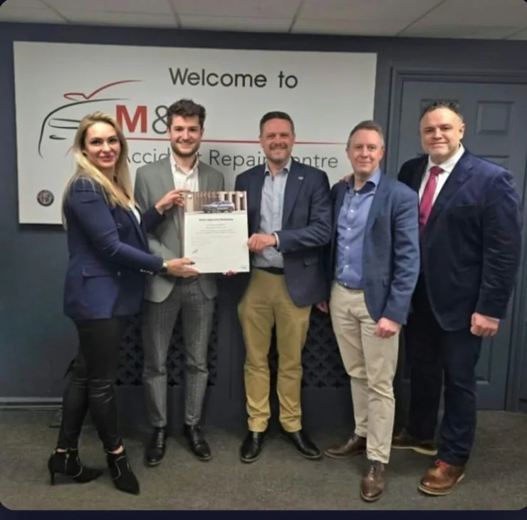 M&E management receiving confirmation of Official Volvo Approved Bodyshop status from the Volvo UK team